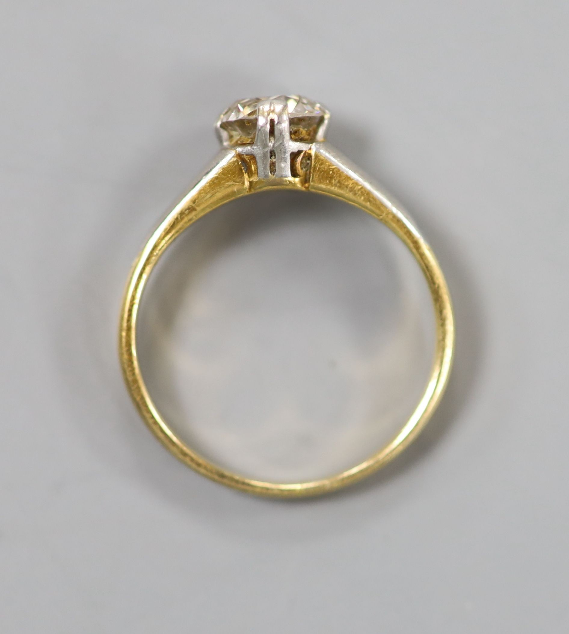 A yellow metal and solitaire diamond ring, the stone weighing approx. 0.75-0.80ct, size K, gross weight 3.5 grams.